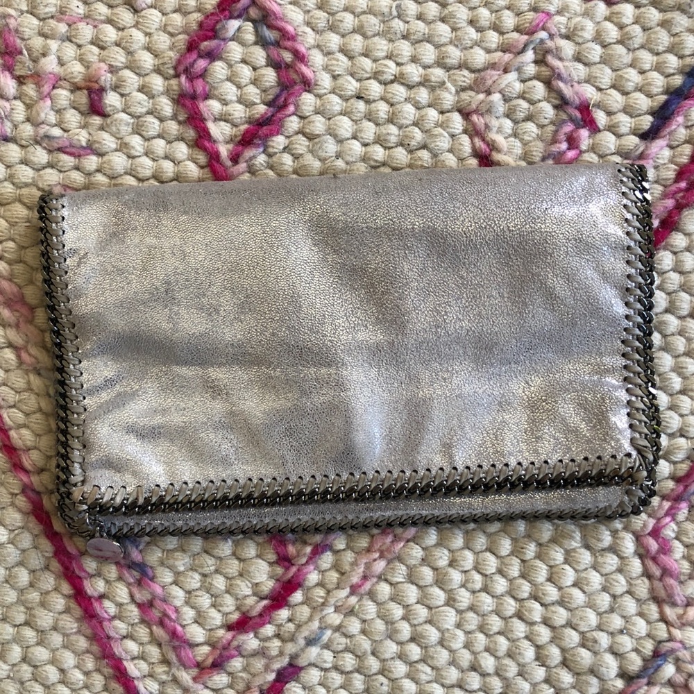 Authentic Stella McCartney silver clutch *damaged*